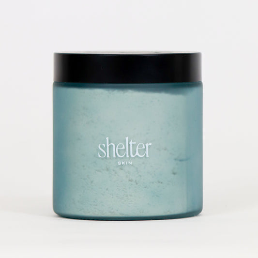 Coconut Milk Bath Melt in a frosted blue jar with a black lid, perfect for a soothing bath experience.