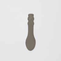 Body Butter Spatula in gray, designed for easy application of body butter products.
