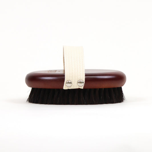 Sculpting Copper Dry Brush with a wooden handle and soft bristles for body exfoliation.